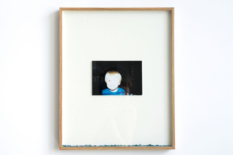 Close up of Bailey's work inside exhibition Mudlark