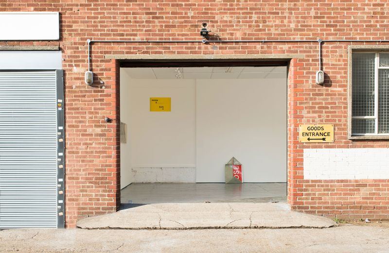 Installation view of exhibition Calibrations from the shutter entrance of the gallery