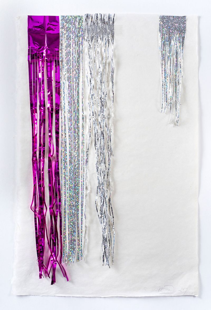 CLose up of Sam McEwen's work, canvas with sparkly garland