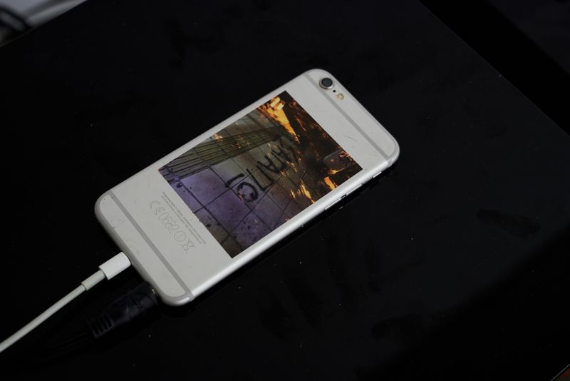 Iphone on speaker with editioned sticker with sound by Beatrice Vorster for pinch to zoom exhibition